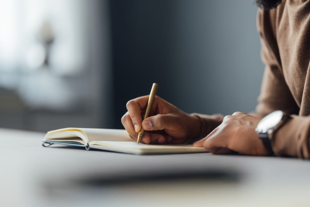 Man Writing - Sash Advisers